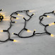Светодиодная гирлянда с колпачком 100 теплых белых LED ламп 10 м., 24В., черный провод ПВХ, IP65, LTC (PST100CAP-11-1WW) 